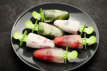 Sweet homemade dessert, popsicles (sorbet) for summer coolness. Frozen juice and ice cream.