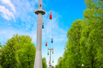 Obraz premium Ski lift in green summer park. Wide panoramic background.