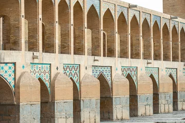 Photo sur Plexiglas Pont Khadjou mosaic elements of Khaju Bridge with plenty of arches over Zayandeh river, iranian pattern, Serving as a dam as well