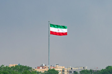 View of the Iranian flag from Khaju Bridge over the Zayandeh river - 276072999