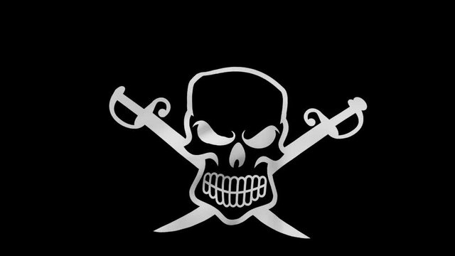 Close-up of a pirate flag blowing in the wind. Jolly Roger with swords.