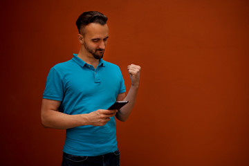 Portrait of modern young man with mobile phone