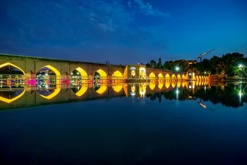 Photo sur Plexiglas Pont Khadjou 22/05/2019 Isfahan, Iran, little and cozy Chobi Bridge at evening alredy iluminated over river Zayanderud in city Isfahan