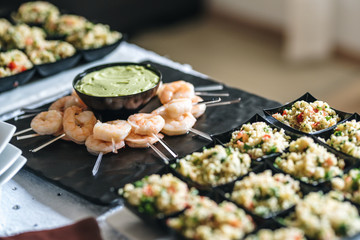 Catering food service - shrimps with pipian sauce and tabouli.