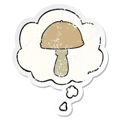cartoon mushroom and thought bubble as a distressed worn sticker