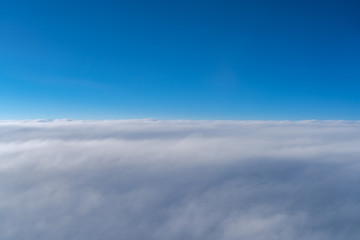 Fototapeta premium View of dark blue sky horizon, up in the air. viewed from an airplane window