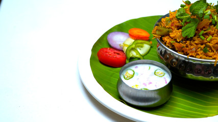 Vegetable biriyani with onion raitha