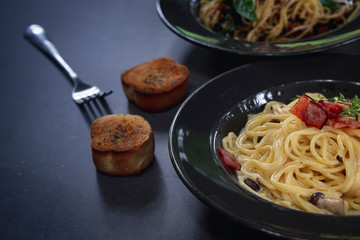 Italian pasta spaghetti dish. Stir-fried spaghetti with chicken, bacon and mushroom.