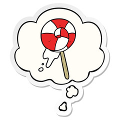 cartoon lollipop and thought bubble as a printed sticker