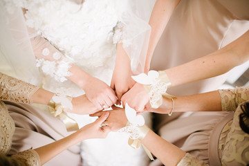 Bridesmaids bridesmaids from flowers on their hands