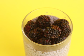 glass of chia pudding with blackberry flavor