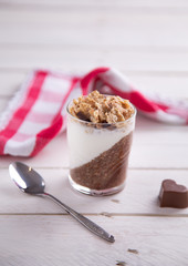 Delicious breakfast, cocoa chia pudding with yogurt and cereals