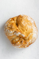 Bread loaf on a white background top view