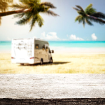 Desk of free space and summer beackground of beach with sea