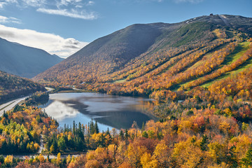 View of Echo Lake from Artist's Bluff in autumn. Fall colours in Franconia Notch State Park. White...