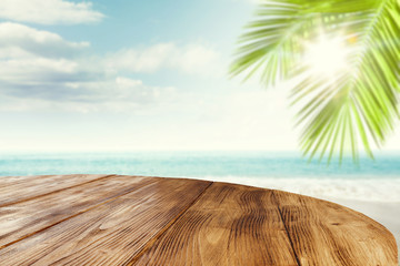 Desk of free space and summer beackground of beach with sea