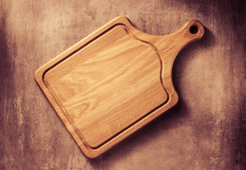cutting board at grey stone table