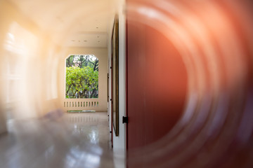 The building through a plastic bottle with a blurred bottle on blurred natrue background....