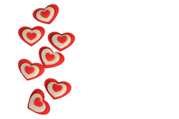 Red and white hearts on a white background with a place for the inscription on the right.