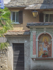Votive shrine in the characteristic alleys of the island of San Giulio. Piedmont, Italy