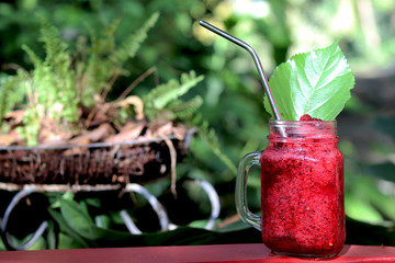 Fresh mulberry smoothies with stainless steel drink straw. Concept for reduce plastic pollution and support green eco friendly products.