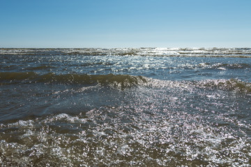 Blue and foamy Baltic sea water.