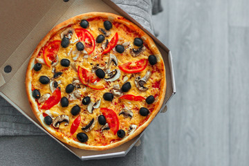 pizza, mushrooms, olives, chicken, tomato sauce, cheese, (pizza ingredients). hot pizza. Top view. copy space
