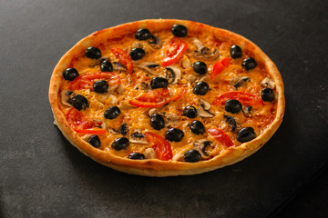pizza, mushrooms, olives, chicken, tomato sauce, cheese, (pizza ingredients). hot pizza. Top view. copy space