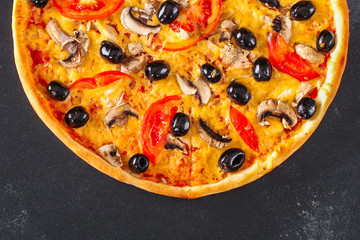 pizza, mushrooms, olives, chicken, tomato sauce, cheese, (pizza ingredients). hot pizza. Top view. copy space
