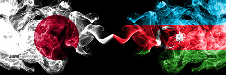 Japan vs Azerbaijan, Azerbaijani smoky mystic flags placed side by side. Thick colored silky smokes combination of Azerbaijan, Azerbaijani and Japanese flag