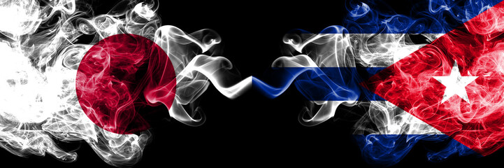 Japan vs Cuba, Cuban smoky mystic flags placed side by side. Thick colored silky smokes combination of Cuba, Cuban and Japanese flag