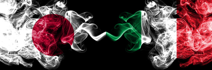 Japan vs Italy, Italian smoky mystic flags placed side by side. Thick colored silky smokes...