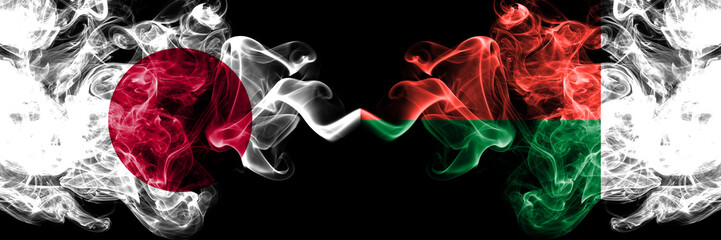 Japan vs Madagascar, Madagascan smoky mystic flags placed side by side. Thick colored silky smokes combination of Madagascar, Madagascan and Japanese flag