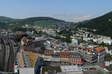 Switzerland: The view to the train station in the old town of Baden City in canton Aargau from the chateau above