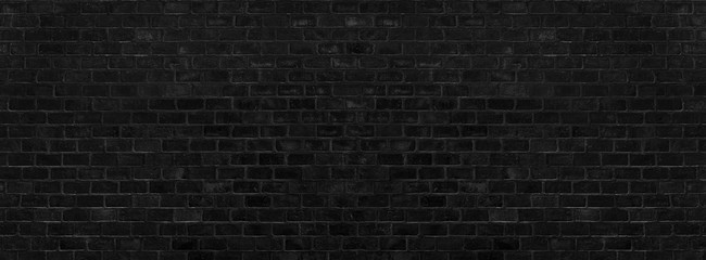 Black brick wall texture and background. Paint brickwork and copy space.