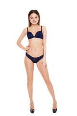 Naklejka premium Young girl in blue lingerie isolated on white background