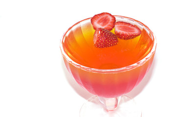 Chilled jelly in a glass dish covered with condensate.