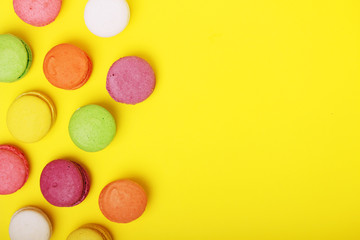 Bright background with a rows of macaroons and copy space
