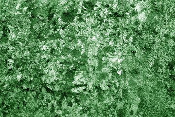Old stone surface in green tone.