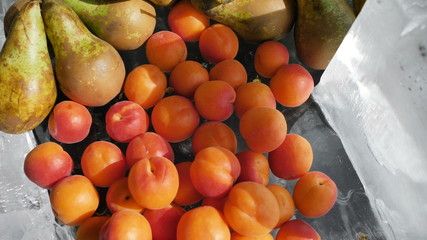 Catering fruits on ice apricots strawberries grapes blueberries sweet cherry pear. The concept of organic and healthy food for vegetarians vitamin cocktail