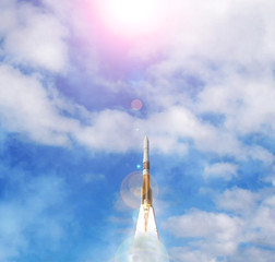 Rocket and clouds. Taking off from ground, lift off. The elements of this image furnished by NASA.