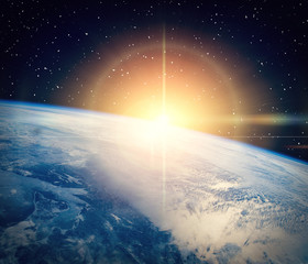 Gorgeous space panorama with the sunrise over the Earth. The elements of this image furnished by NASA.