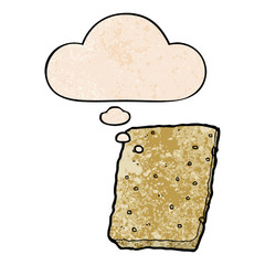 cartoon biscuit and thought bubble in grunge texture pattern style