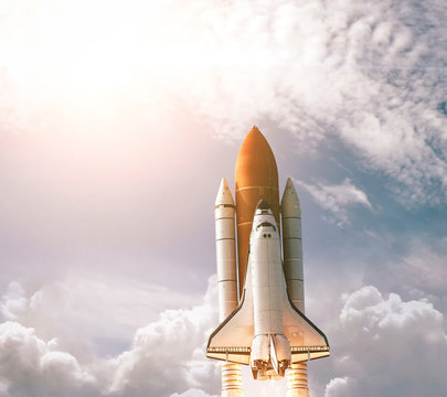 Spaceship Leaving Earth. Space craft taking off into deep space. Elements of this image furnished by NASA.