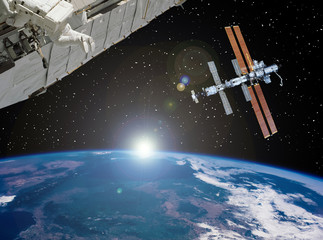 Space station and spaceship above the earth. The elements of this image furnished by NASA.