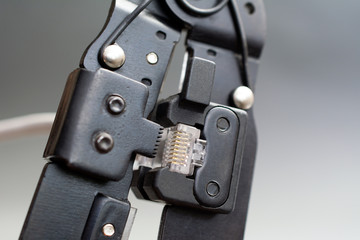 Champper Ethernet patch cable, Ethernet Network Cable Crimp Crimping Crimper Tool, close up gray background