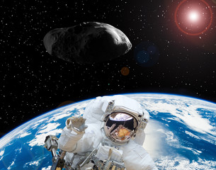 Astronaut waving. Asteroid in outer space. The elements of this image furnished by NASA.