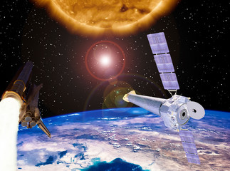 Big sun, space satellite and rocket. Earth from space. The elements of this image furnished by NASA.