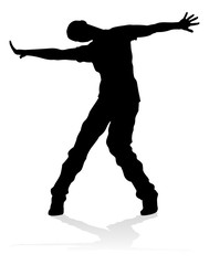 A male street dance hip hop dancer in silhouette