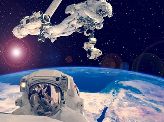Astronaut spacewalk. Other astronaut on the backdrop. Space scene. The elements of this image furnished by NASA.